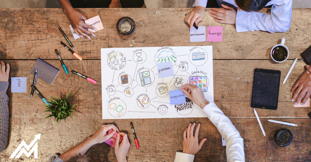 association professionals collaborating on a marketing strategy with digital tools and printed materials.